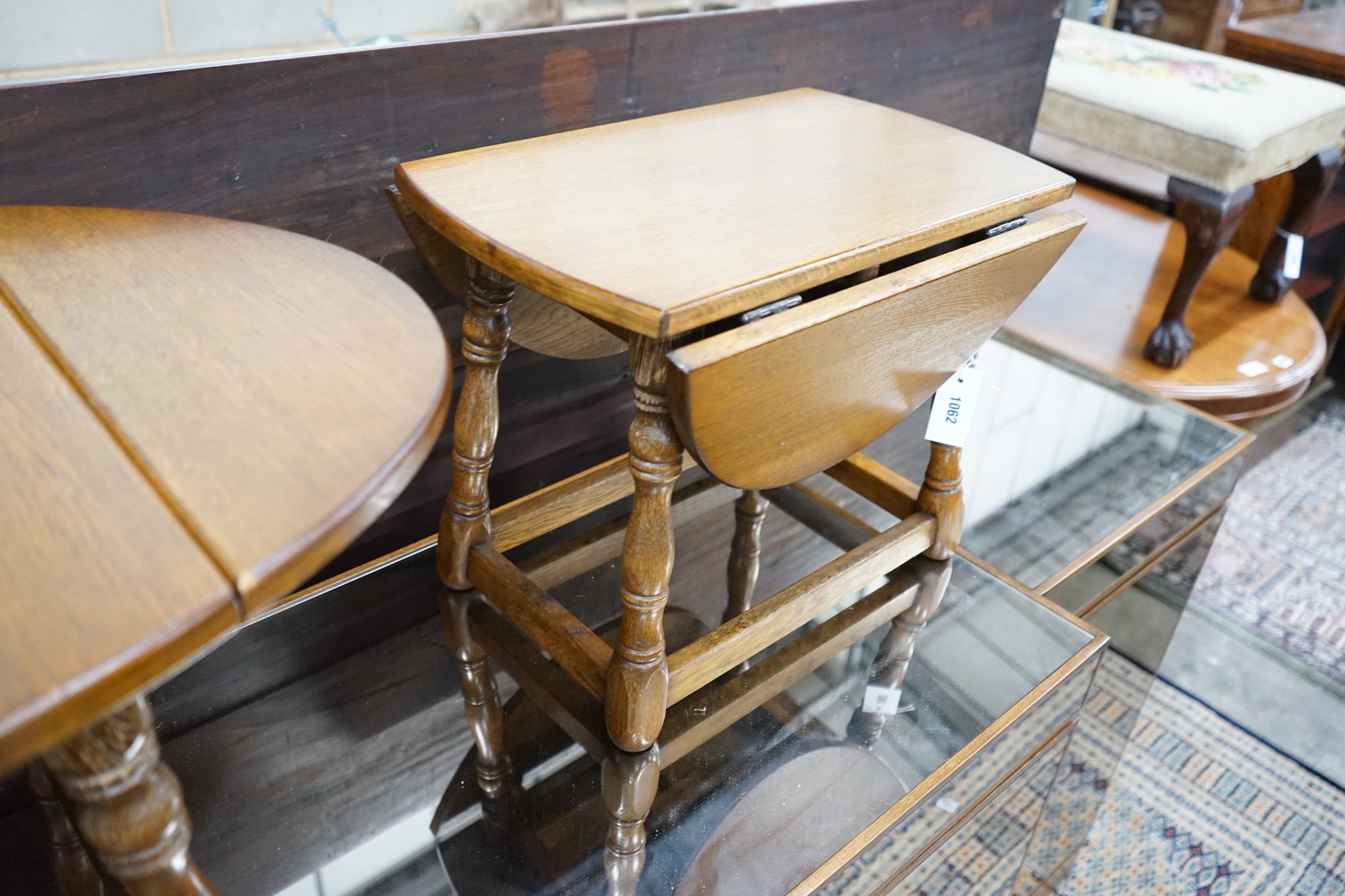 A pair of 18th century style oak drop flap occasional tables width extended 68cms, depth 50cms, height 39cms.